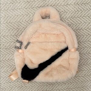 Nike Plush Mini Backpack in Blush Pink with Black Swoosh